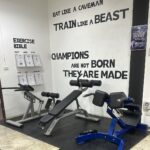 Benches and exercise guides inside Koh Tao Gym and Fitness