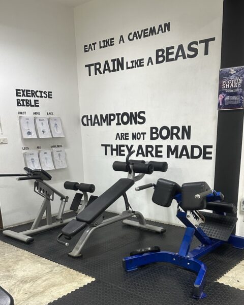 Benches and exercise guides inside Koh Tao Gym and Fitness